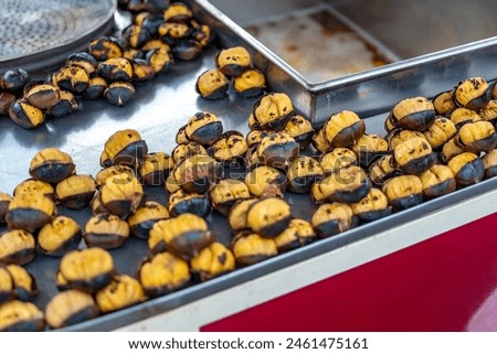 Fried chestnuts on the street of Istanbul, Turkey. Chestnut is traditional Turkish street food.
