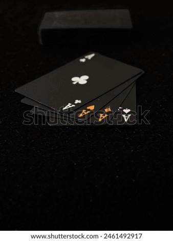 Playing cards on a black background, close-up, shallow depth of field