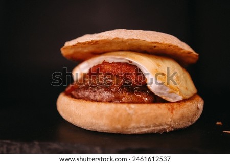 Bacon cheese burger on black background