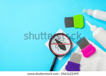 Anti lice equipment on blue background top view