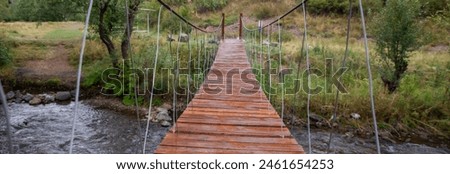 A wooden bridge over a lake, stock photo