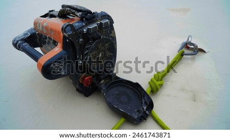 rope access machine.rope access automatic installation.green rope with carabiner at anchor point.rope access