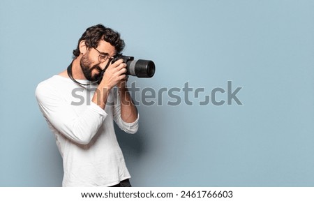 young crazy bearded photographer man