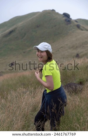 Hiker asian woman backpack walking trail activity camping outdoors and People exploring forest green natural capturing beauty nature outdoor.