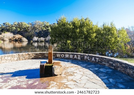 DAYLESFORD, AUSTRALIA - MAY 12 2024: Wombat Flat spring and landscape around Lake Daylesford in a cool late autumn afternoon in Daylesford, Victoria, Australia Royalty-Free Stock Photo #2461782723