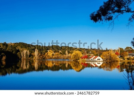DAYLESFORD, AUSTRALIA - MAY 12 2024: Landscape around Lake Daylesford in a cool late autumn afternoon in Daylesford, Victoria, Australia Royalty-Free Stock Photo #2461782759