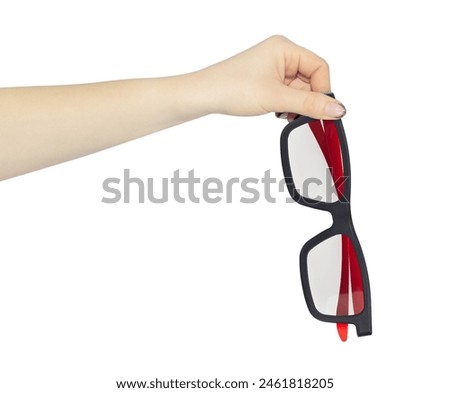 plastic glasses for watching 3D cinema in the cinema, sunglasses in hand, outstretched hand with plastic glasses isolated from background