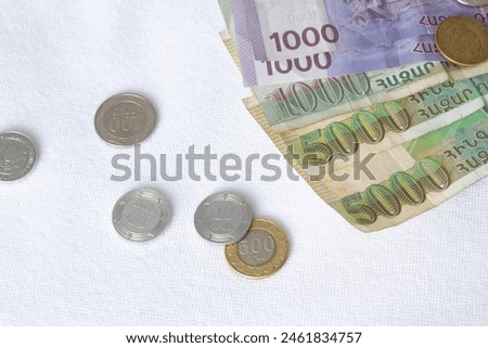 100, 200, 500, 1000, 5000 Armenian drams. Horizontal photo. Paper banknotes and coins on white background. Cash money of Armenia. Concept of travel, tourism, credit, rich, profit, tax, debt. Bank note
