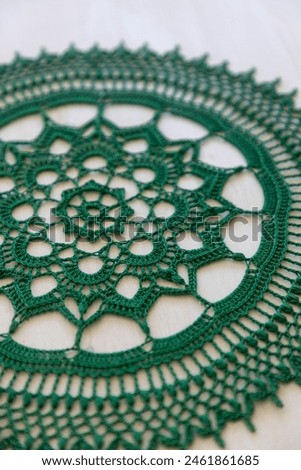 Green crochet doily. This photo has been taken in Kladno, Czech Republic, 2024