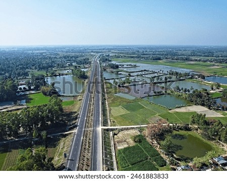 Raiganj west bengal india top aerial still picture of a indian village with national highway in between