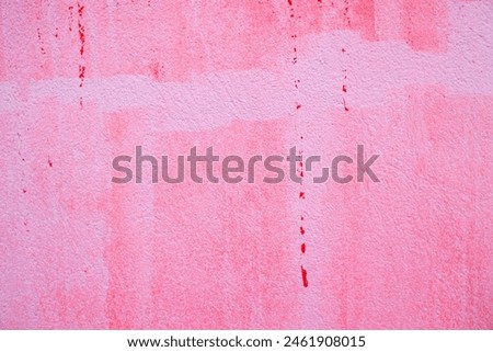 Abstract background of a weathered red paint wall cement texture