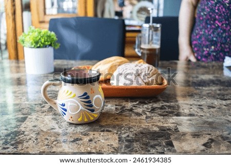 breakfast with coffee in traditional Mexican cup and bread, Mexican food Royalty-Free Stock Photo #2461934385