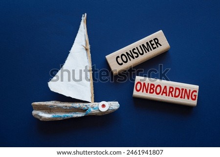 Consumer Onboarding symbol. Wooden blocks with words Consumer Onboarding. Beautiful deep blue background with boat. Business and Consumer Onboarding concept. Copy space.