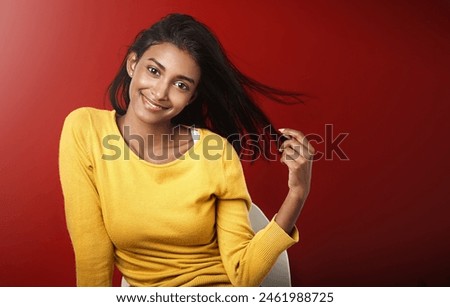 Studio, portrait and happy woman with casual fashion, relax and positive attitude of female person on mockup space. Smile, face and gen z girl with cool style, confidence and pride on red background