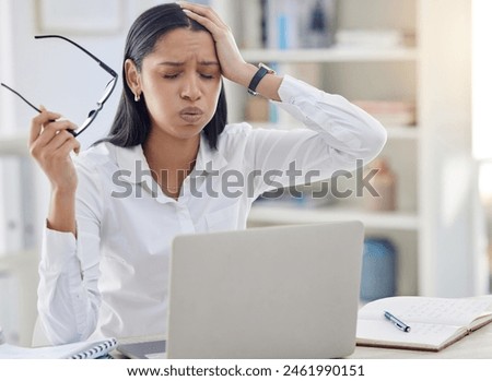 Migraine, glasses and business woman with pain in office for editing report, burnout or project deadline. Fatigue, laptop and tired journalist, editor or professional employee at desk for news agency