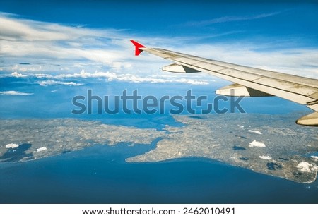 Northern tip of Cebu and Bogo City as seen from an airplane. Royalty-Free Stock Photo #2462010491