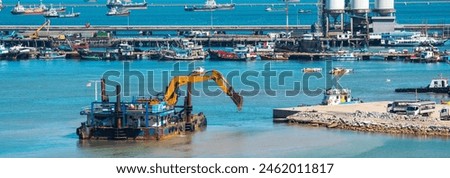 Logistic shipping quay boat Engineering crane depot at logistic export terminal control. Warehouse freight background container yard loading quayside harbor port. Logistics seascape shipping portal