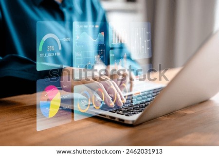 Businesswomen analyze chart data business on a visual screen dashboard laptop, technology devices and screens visible in the background, financial planning, KPI, market research, and the stock market.