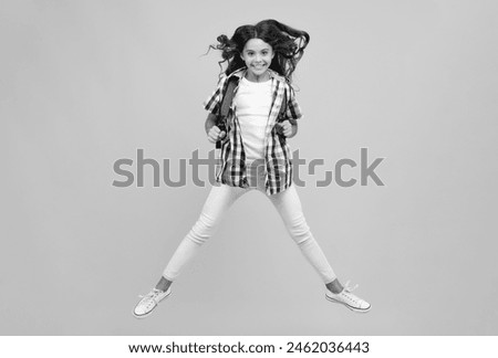 Amazed teen girl. Schoolgirl with backpack. Teenager student, isolated background. Learning and knowledge. Go study. Children education concept. Back to school. Run and jump.