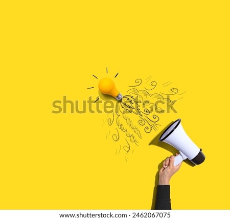 Attention and announcement concept with an idea light bulb flying to the sky like a rocket - Flat lay Royalty-Free Stock Photo #2462067075