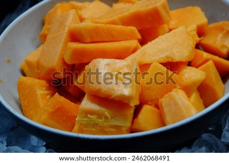 Fresh papaya slices in a bowl ready to eat