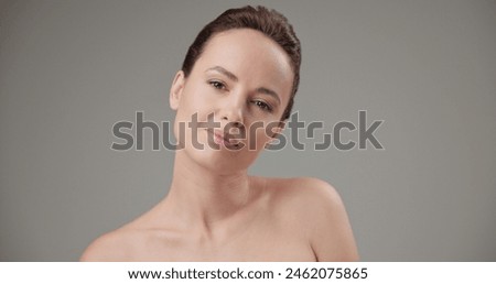 Beauty, health, cosmetics, anti-aging therapy and skin care concept - young beautiful brunette Caucasian woman standing in front of the camera and posing