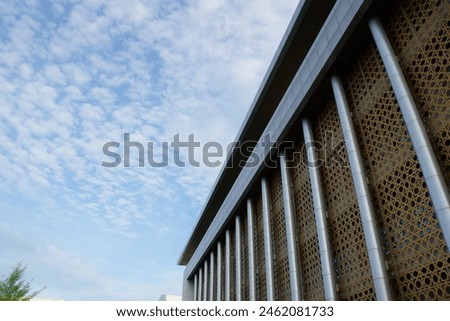 Picture of building with sky background and clouds with low angle view