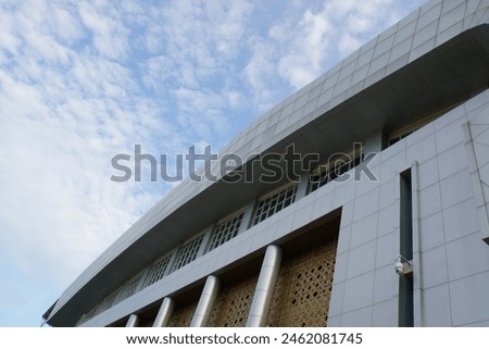 Picture of building with sky background and clouds with low angle view