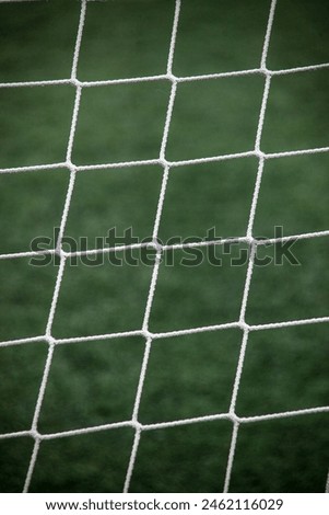 Soccer goal net close-up shot, perfect for sports-related stock photography.