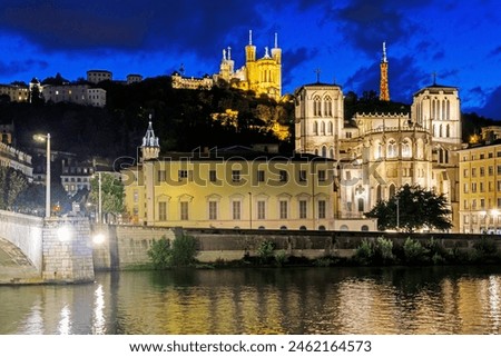 Beautiful view of Cathedral Saint-Jean-Baptiste, Notre-Dame de Fourviere Basilica and Saone river at dusk, Lyon, France Royalty-Free Stock Photo #2462164573