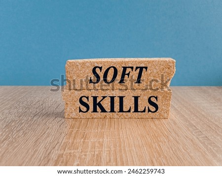 Soft skills symbol. Brick blocks with words Soft skills. Beautiful blue background, wooden table. Business and Soft skills concept. Copy space.