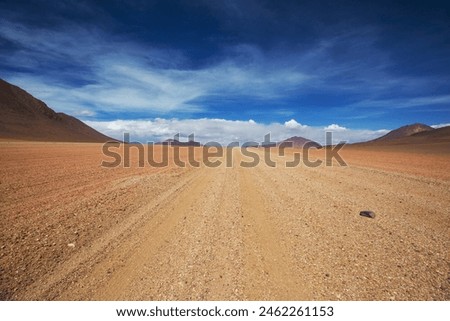 Scenic road in the Altiplano, Bolivia. Travel background. Royalty-Free Stock Photo #2462261153