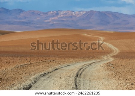 Scenic road in the Altiplano, Bolivia. Travel background. Royalty-Free Stock Photo #2462261235