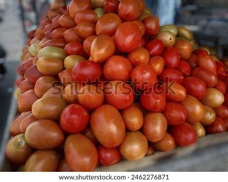 Red tomatoes for sale in market closeup