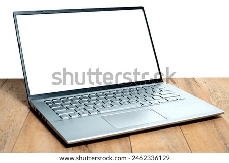 Mock up blank screen laptop on wooden table