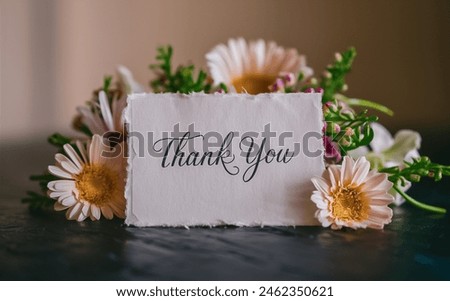 A thank you card with colourful flowers 