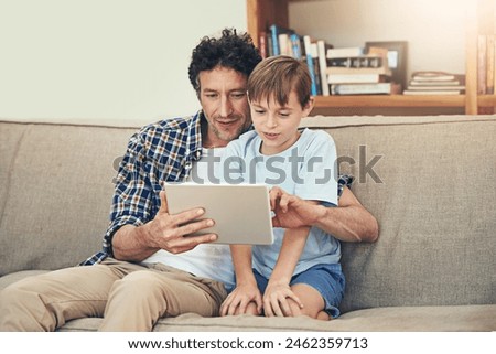 Sofa, tablet and father with child in home for watching movies, cartoons and online entertainment. Family, love and happy dad with son on digital tech for internet, video call and relax on weekend