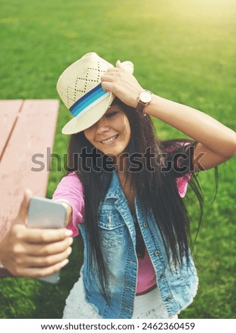 Outdoor, girl and selfie on bench in park for profile picture on social media or memory of summer vacation in California. Woman, holiday and sunshine with photography for post with hat and attitude.