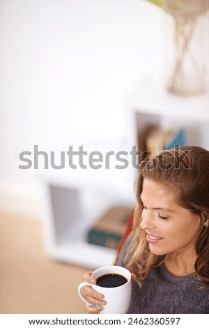 Coffee, relax and woman in home for rest with lazy weekend, morning peace and drink with caffeine. Female person, happiness and espresso cup in apartment living room with smile for calm in high angle Royalty-Free Stock Photo #2462360597