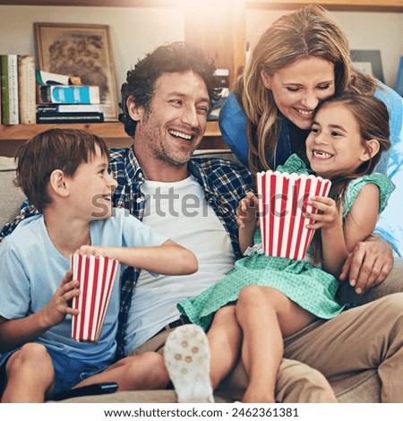 Happy family, relax and laughing with popcorn on sofa for funny movie, weekend or holiday in living room at home. Mom, dad and children with smile for comedy, series or streaming service at house