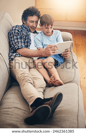Relax, tablet and father with child on sofa in home for watching movies, cartoons and online entertainment. Family, love and dad with son on digital tech for internet, video call and relax on weekend