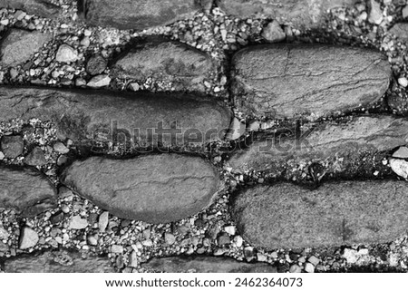 Background stone wall made of grey stones