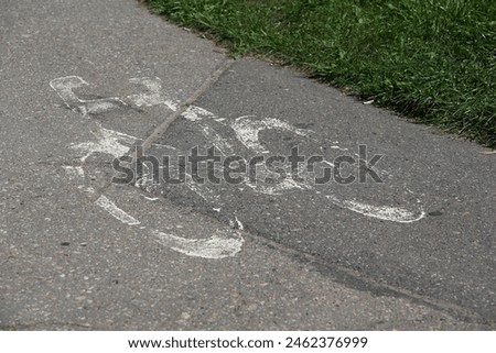 The shape of a white bicycle on the road is a traffic sign. It indicates that there is a cycle path for cyclists.
