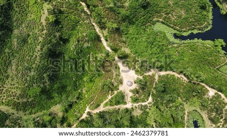 Aerial view of a lush green tea garden on top of a hill in Srimangal, Sylhet, Bangladesh. landscape photography.