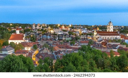 Panoramic view of Vilnius townscape against sky at evening