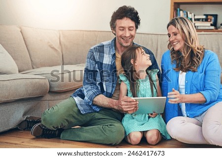 Home, tablet and parents with child on floor for watching movies, cartoons and online entertainment. Family, love and happy dad, mom and girl on digital tech for internet, videos and relax on weekend