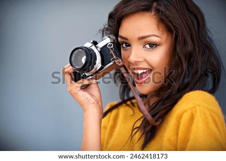 Portrait, excited and woman with retro camera by studio background for shooting photo, image or picture. Mockup space, female photographer for creative memory, lens and focus with vintage equipment