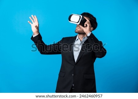 Smart business man holding something while touching VR goggle. Project manager planning marketing strategy while using visual reality headset to connect metaverse. Technology innovation. Deviation.