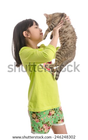 Cute asian girl hugging a little cat isolated on white background