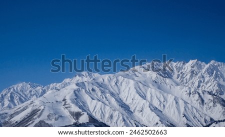 Northern Alps and clear skies in midwinter, Hakuba Village, Nagano Prefecture Royalty-Free Stock Photo #2462502663